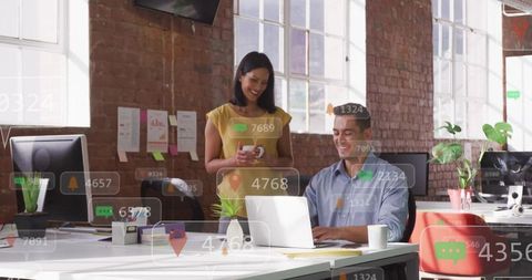 Coworkers Collaborating in Modern Tech-Savvy Office Setting