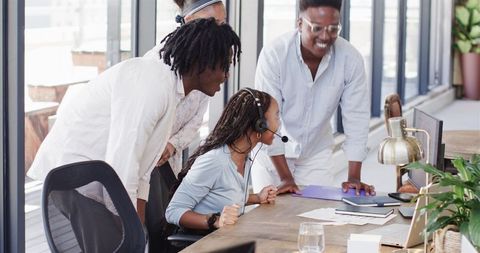 Team Celebrating Success in Modern Office, Smiles and Cheers