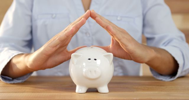 Hands Covering White Piggy Bank for Financial Protection - Download Free Stock Images Pikwizard.com