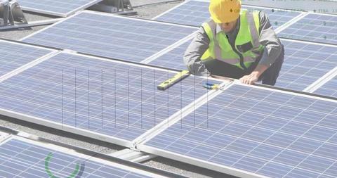 Engineer Working on Solar Panels with Digital Financial Data Overlay - Download Free Stock Images Pikwizard.com