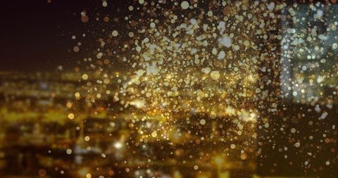 Golden edged cityscape with floating lights