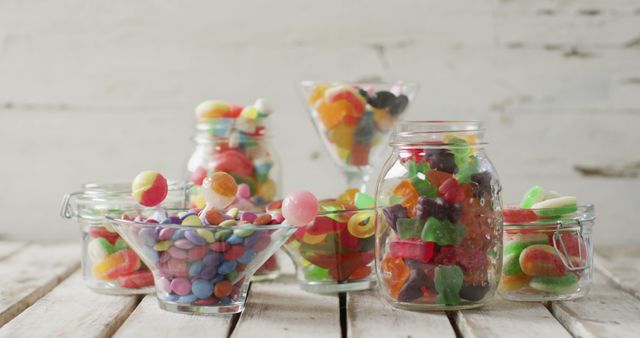 Assortment of Colorful Candies in Various Glass Jars and Bowls - Download Free Stock Images Pikwizard.com