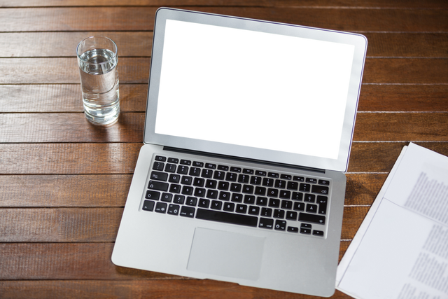 Transparent Screen Laptop with Water Glass on Wooden Desk - Download Free Stock Videos Pikwizard.com