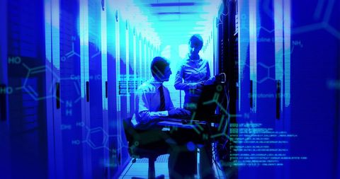 Tech Experts Managing Data Servers in Futuristic Environment - Download Free Stock Images Pikwizard.com