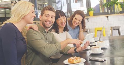 Friends socializing over coffee in modern cafe relaxed dining sight