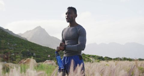 Athletic Man Mid-Workout in Serene Natural Landscape