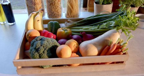 Crate of Fresh Fruits and Vegetables on Sunny Kitchen Worktop - Download Free Stock Images Pikwizard.com