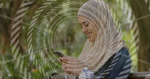 Smiling Woman Reading Smartphone on Park Bench Surrounded by Spiral Design