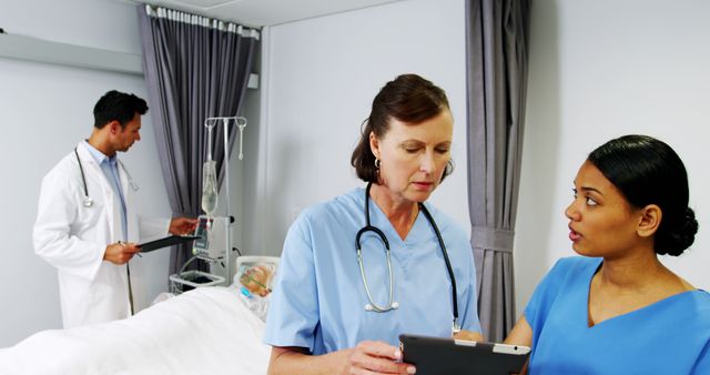 Medical Professionals Discussing Patient Care in Hospital Room - Download Free Stock Images Pikwizard.com