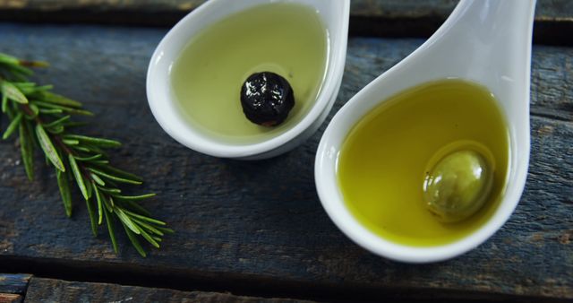 Close-Up of Olive Oil Tasting Samples with Olive and Herb - Download Free Stock Images Pikwizard.com