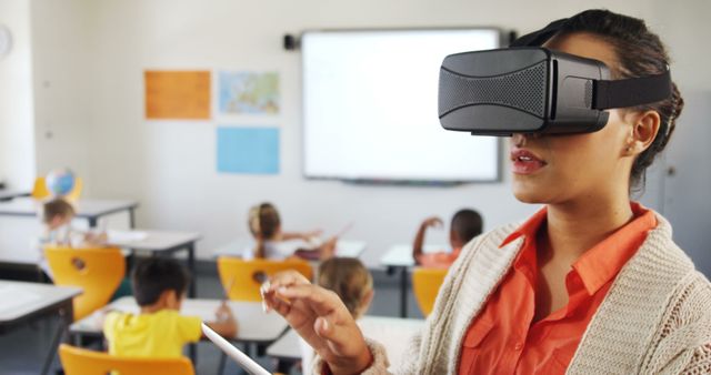 Teacher engaging with VR technology in front of students in classroom. Useful for educational technology promotions, modern teaching methods, and school innovation concepts.