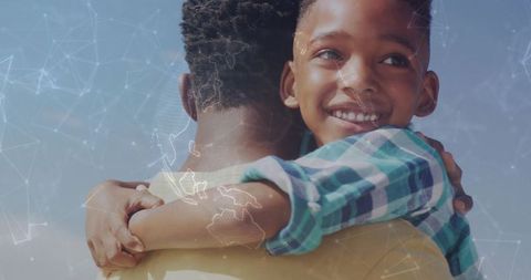 Father carrying son outdoors embracing joy and warmth with digital globe network overlay