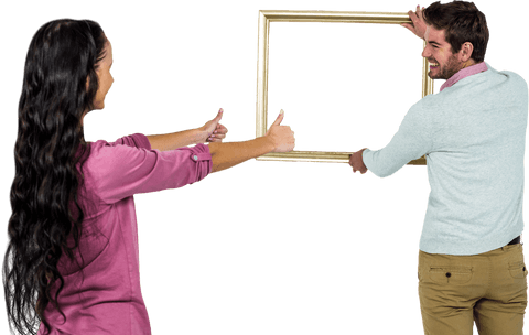 Smiling couple holding transparent picture frame for display