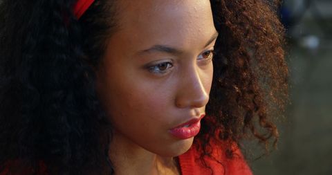 Focused female fashion designer working at office desk