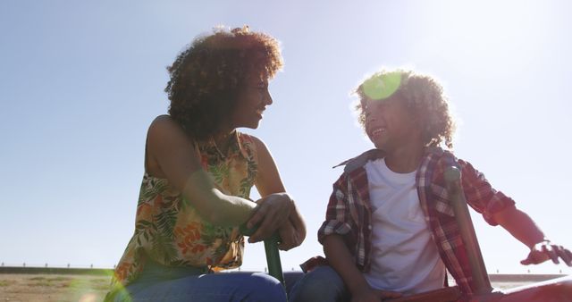 Happy Mother and Son Bonding Outdoors in Sunny Weather - Download Free Stock Images Pikwizard.com