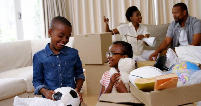 Happy Family Unpacking Boxes in New Home, Children Playing - Download Free Stock Images Pikwizard.com