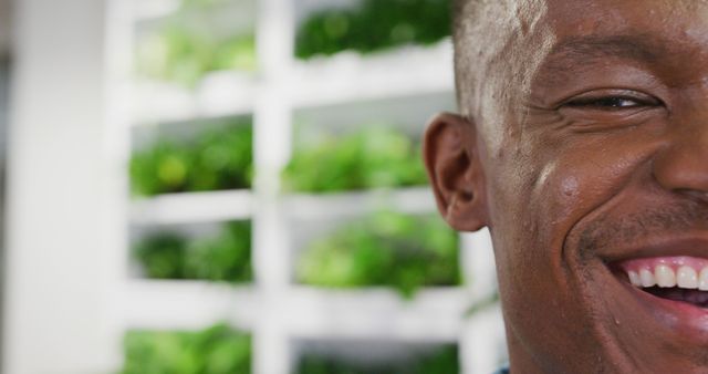 Close-up of smiling man with greenery background - Download Free Stock Images Pikwizard.com