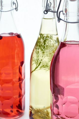 Artisan fruit-infused health drinks in clear bottles