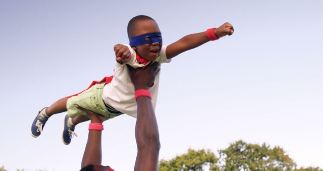 Child Pretending to be Superhero Lifted in Air - Download Free Stock Images Pikwizard.com