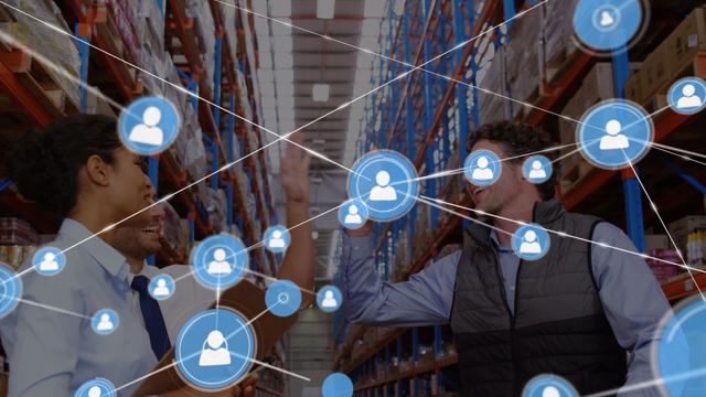 Warehouse workers joining hands in gesture of success with digital network graphics overlay. Concept represents teamwork and effective communication enhanced by technology in business operations. Useful for illustrating diversity in the workplace, celebration of achievements, and digital transformation in logistics.