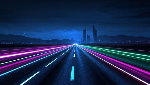 Stretching neon highway leading toward futuristic city skyline at night with light trails