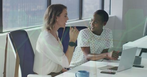 Diverse Coworkers Discussing Financial Strategy in Modern Office