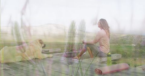 Woman Enjoying Tranquil Mountain Retreat with Loyal Dog