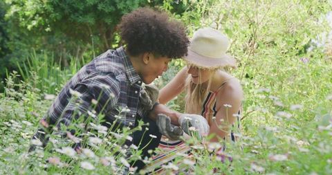 Joyful Couple Gardening Together in Lush Backyard Retreat