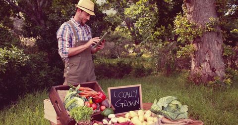 Young Caucasian Farmer Displaying Locally Grown Fresh Produce