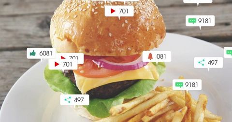 Showing juicy cheeseburger with sesame bun and fries with social media engagement overlays