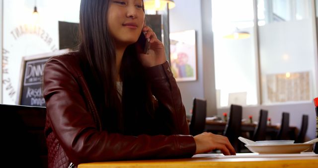 Young Woman Talking on Phone in Cozy Cafe - Download Free Stock Images Pikwizard.com