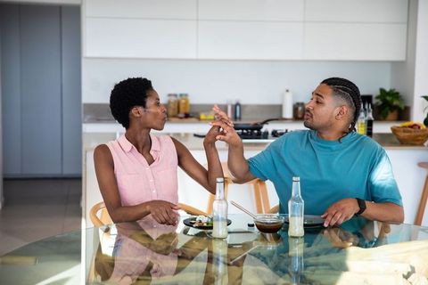 Diverse Couple Enjoying Romantic Meal in Modern Home Kitchen