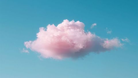 Dreamy pastel pink cumulus cloud floating on cyan sky minimalist airy surreal background