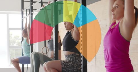 Diverse women exercising with digital health interface