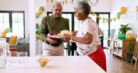 Senior Friends Celebrating Retirement Together at Home