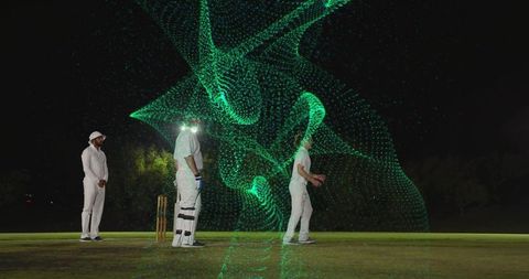 Night cricket players reacting to holographic green data wave on illuminated pitch