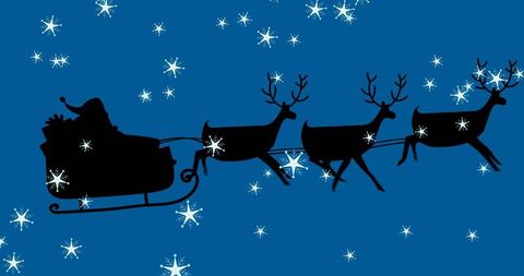 Silhouette of Santa and Reindeer Flying Across Night Sky