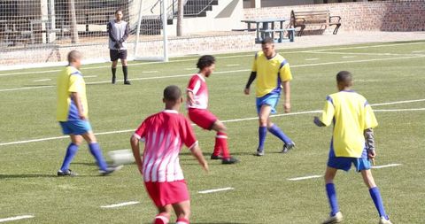 Intense Soccer Match with Players Competing on Field