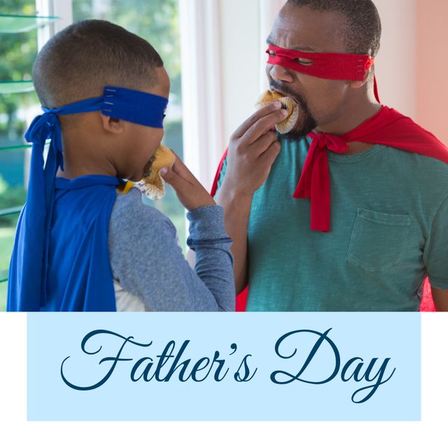 African American father and son enjoy spending time together on Father's Day dressed in superhero costumes. They share a sweet moment eating muffins, highlighting their bond and family joy. Ideal for campaigns focused on family love, holiday festivities, and superhero-themed celebrations.