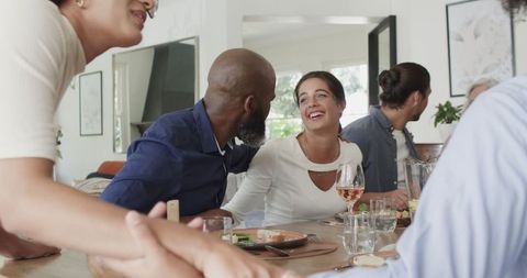 Joyful Wedding Reception with Guests Enjoying Lively Conversation