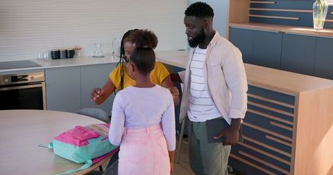 Family morning routine: daughter heading to school