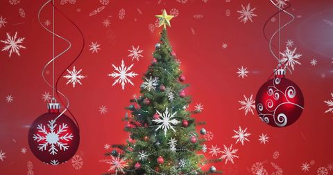 Vibrant Christmas Tree with Baubles and Falling Snowflakes - Download Free Stock Images Pikwizard.com