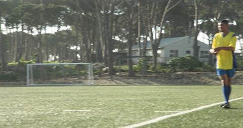 Soccer Player in Momentum on Suburban Field