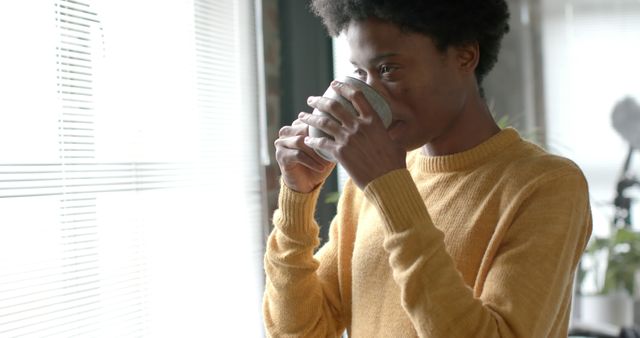 Man Drinking Coffee by Bright Window in Cozy Morning Light - Download Free Stock Images Pikwizard.com