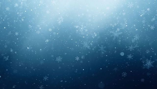 Translucent snowflakes drifting across deep blue gradient with soft bokeh