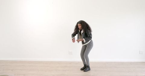 Confident Woman Posing Stylishly in Minimalistic Setting