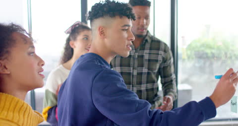 Diverse Team Collaborating on Project in Office Environment