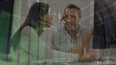 Business Colleagues Analyzing Data with Headsets in Office Meeting