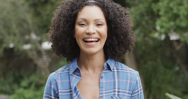 Smiling Woman with Curly Hair Outdoors - Download Free Stock Images Pikwizard.com