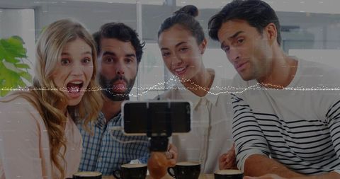 Friends Enjoying Candid Moments with Coffee in Trendy Lounge